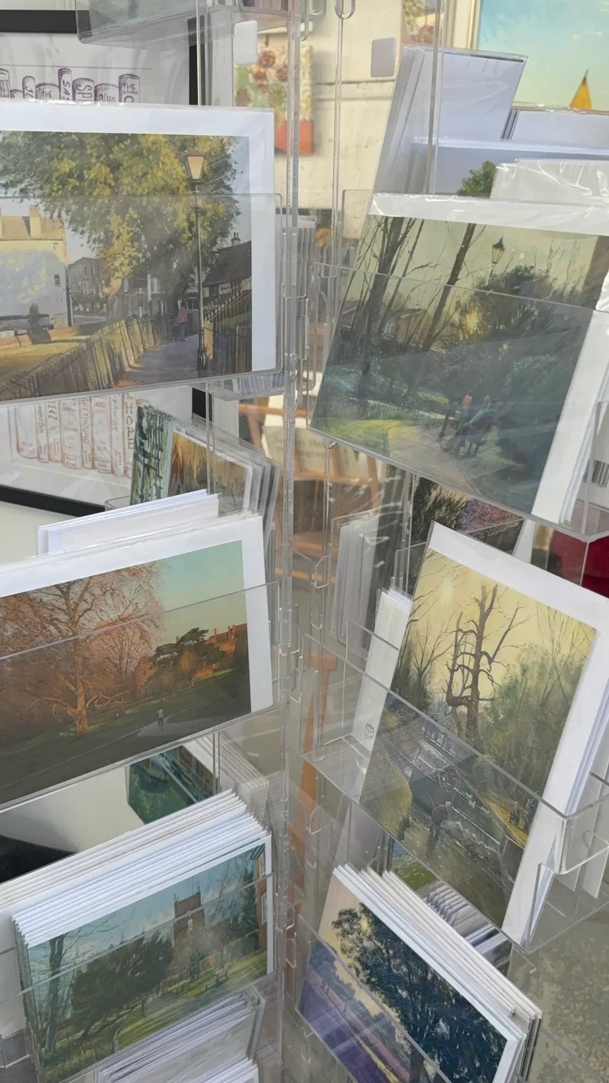Carshalton art prints and cards in a display rack at Vellum Mill Gallery.