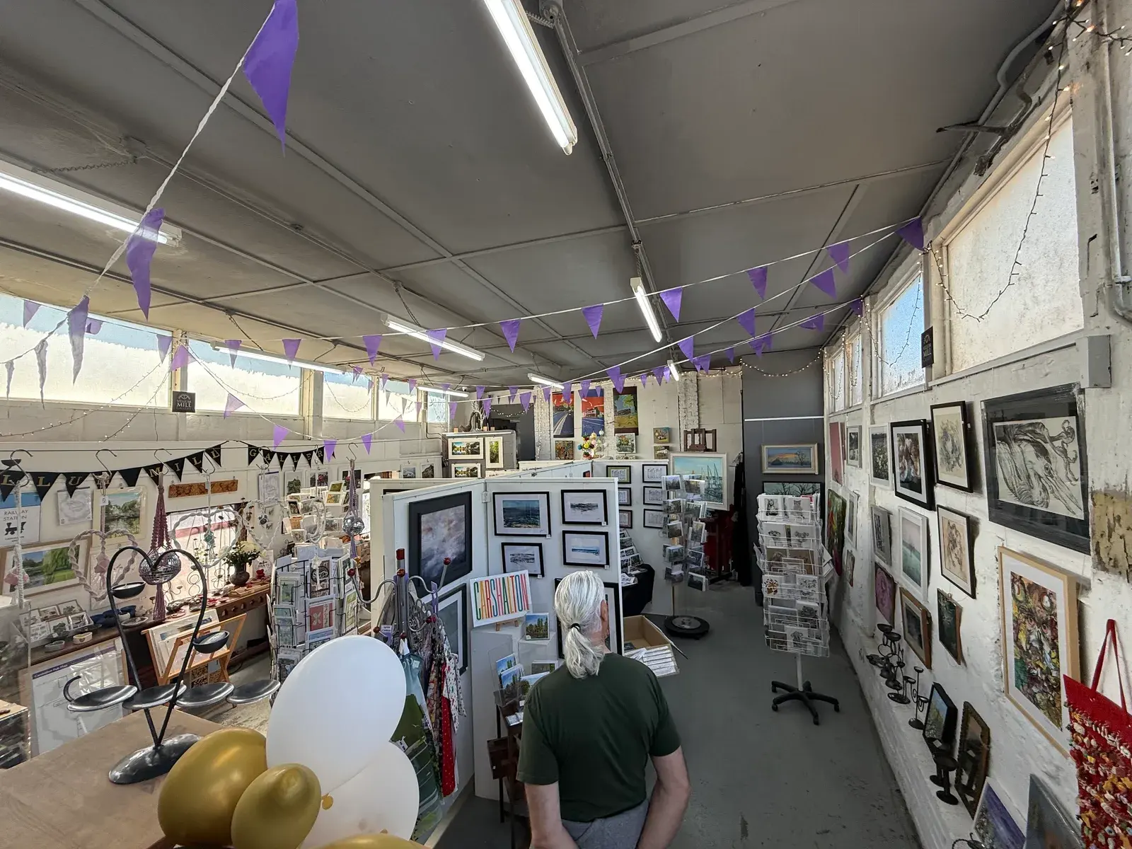 Inside Vellum Mill Gallery in Carshalton with local paintings, prints and handmade gifts on display.